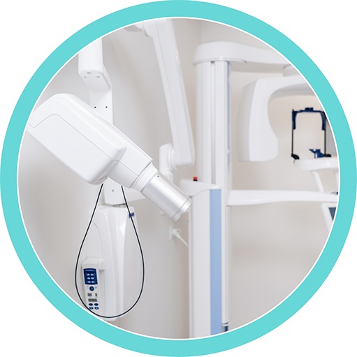 Cone beam CT scanner standing against a white wall