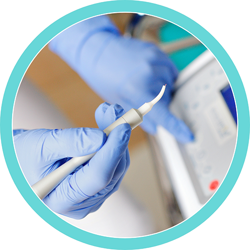 Dentist holding a soft tissue laser pen