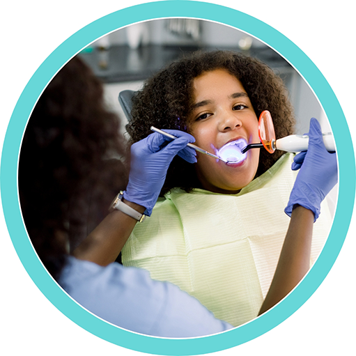 Teenager getting dental bonding treatment
