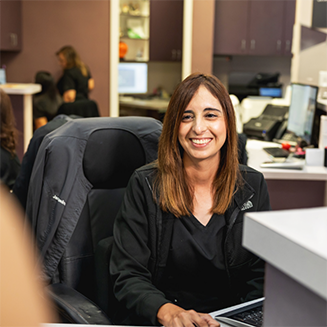 Dental team member working on a computer