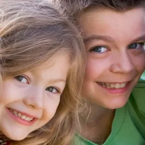A small boy and girl smiling